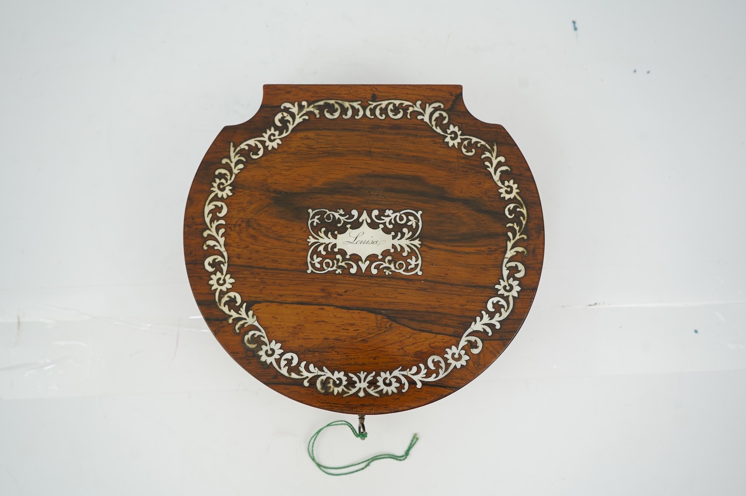 An early Victorian rosewood and mother of pearl inlaid sewing box